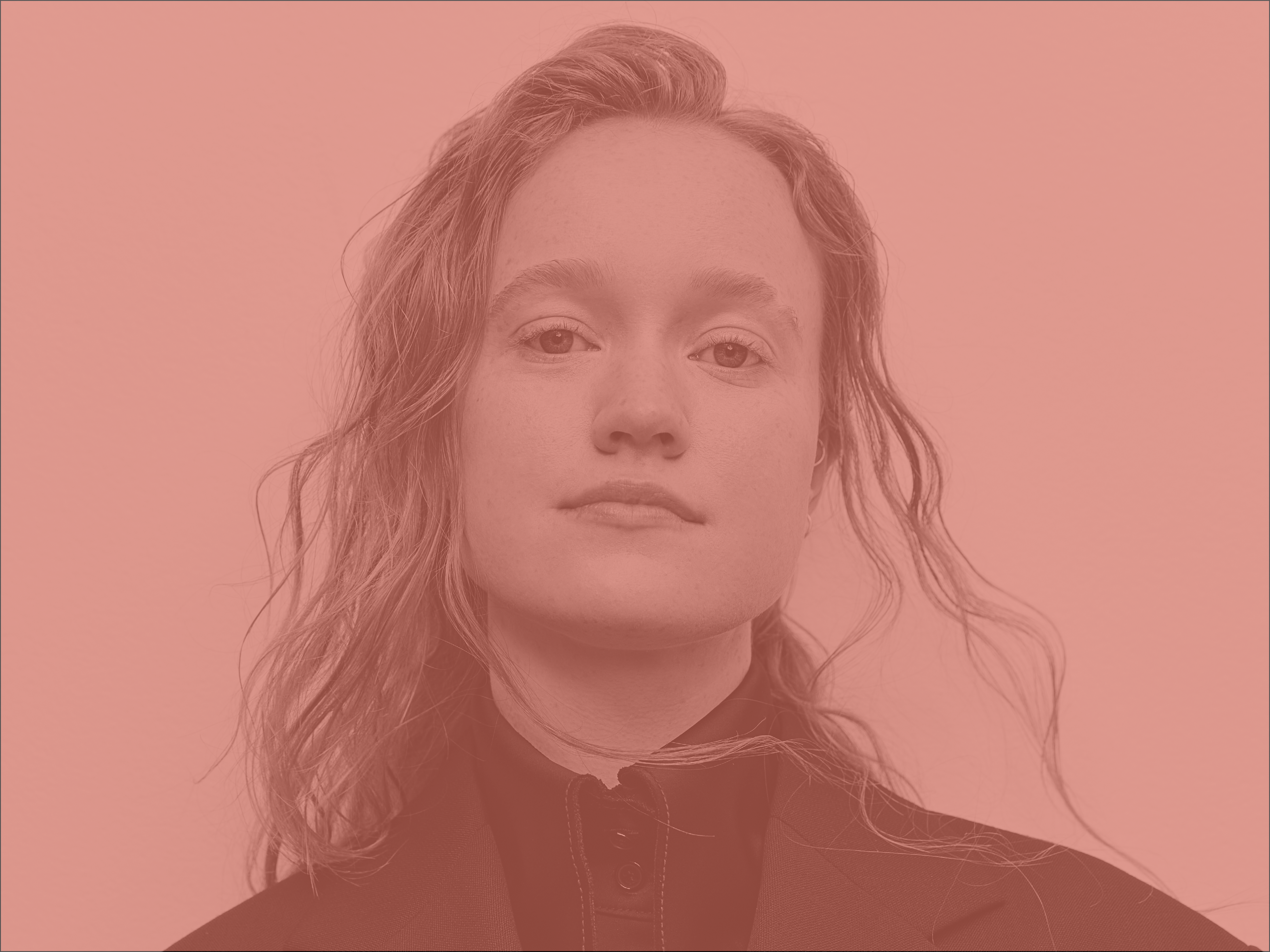 Liv Hewson Headshot: a non-binary person with loose, straggly hair.